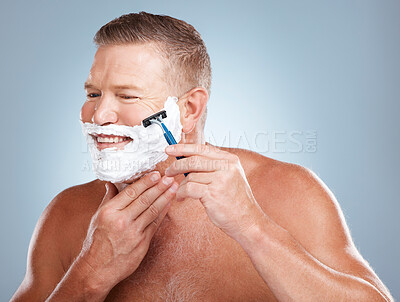 Buy stock photo Face, razor and man with shaving cream in studio isolated on a gray background for hair removal. Thinking, skincare and happy senior male model with foam to shave for aesthetics, health or wellness.