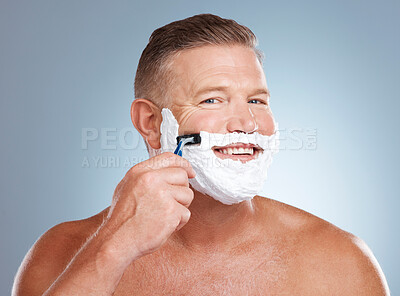 Buy stock photo Shaving, smile and portrait with cream and razor for face cleaning, wellness and skincare. Morning grooming, foam and model with facial care and skin treatment to shave hair in a studio isolated