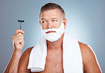 Razor, skincare and old man shaving in studio with foam, beauty or grooming on grey background. Face, blade and mature male model relax for luxury, hair removal and facial, skin and product isolated
