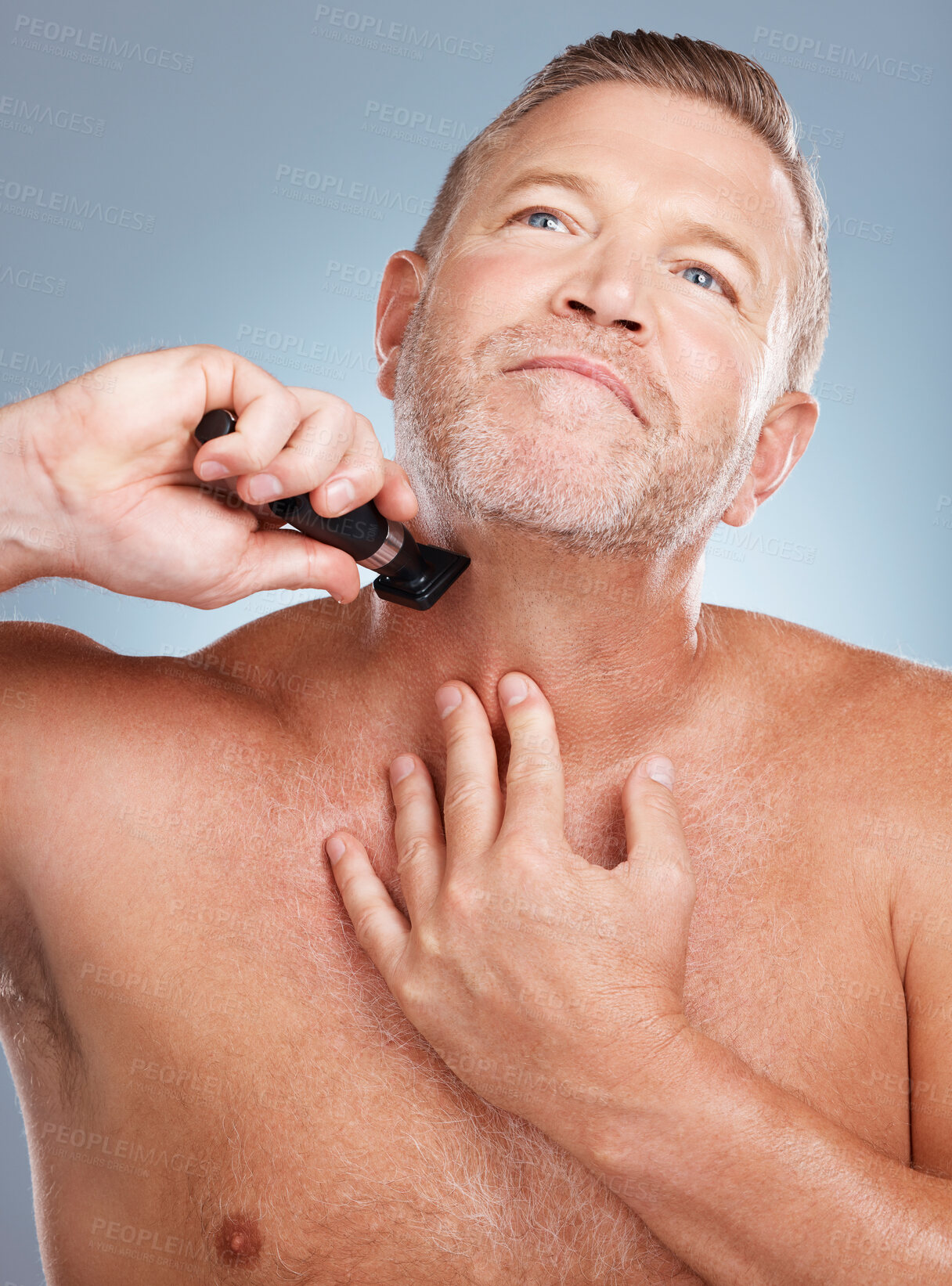 Buy stock photo Grooming, cleaning and man with razor for beard for wellness, healthy skin and hygiene on blue background. Beauty, skincare and face of male with barber shaver for facial, haircare and self care