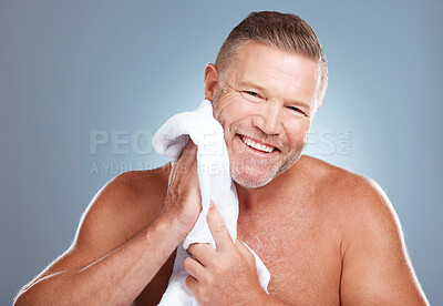 Buy stock photo Skincare, portrait and happy old man in studio with towel for facial, cleaning or grooming on grey background. Face, mature and male model relax with luxury, skin or beauty treatment while isolated