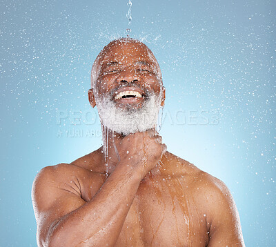 Buy stock photo Water, splash and skincare with black man and shower for beauty, hygiene and dermatology. Wellness, spa and facial with senior model cleaning in blue background studio for health, luxury or hydration