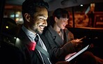 Tablet, business people and man travel in car while on social media, internet browsing or web scrolling. Transport, night and male and woman with mobile technology for networking, typing or texting.