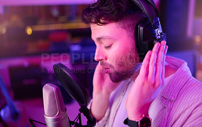 Buy stock photo Musician, singer or man on neon headphones, microphone or studio equipment in practice theatre or night recording. Singing, person or artist in voice production, media sound industry or light theater