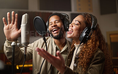 Buy stock photo Music, streaming and black couple recording in studio, singing into microphone with headphones and radio. Technology, art and creative influencer band, man and woman live stream song for record label