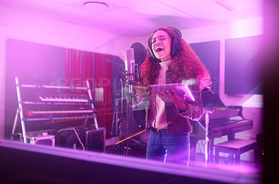 Buy stock photo Technology, singing or woman on neon studio microphone, music lyrics or songwriting app in night recording. Singer, musician or artist on tablet in production, voice media or sound light performance