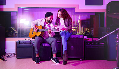 Buy stock photo Black man, woman and songwriting with guitar, studio and night with paper for creative lyrics, notes and ideas. Music team, writing and singing together for professional production with teamwork