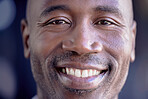 Happy, smile and closeup portrait of a black man with a positive, good and healthy mindset. Happiness, headshot and zoom face of a excited African male model smiling for good news in the studio.