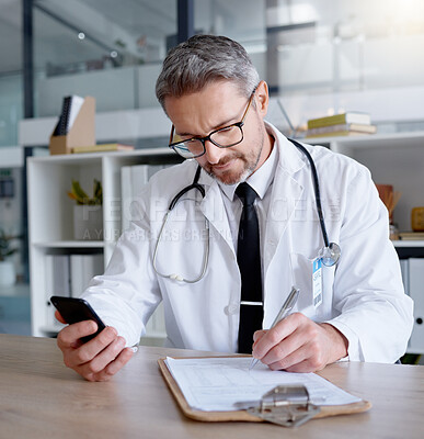 Buy stock photo Man, writing on checklist and doctor with phone in hospital for healthcare, information or research. Telehealth technology, medical smartphone and mature physician with mobile, clipboard or documents