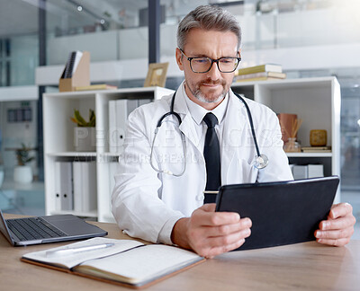 Buy stock photo Medical doctor, tablet and man in hospital for telehealth, online consultation and healthcare. Clinic technology, wellness app and mature male physician with digital touchscreen for health research.