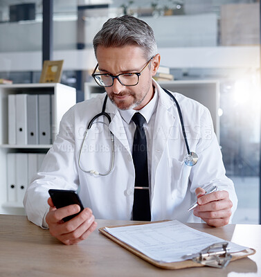 Buy stock photo Man, office and doctor with phone in hospital for healthcare, information or research. Telehealth technology, medical smartphone and mature physician with mobile, clipboard or checklist documents.