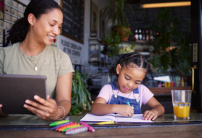 Buy stock photo Coffee shop, family and child with a black woman doing remote work and her daughter coloring a book in a cafe. Tablet, freelance and art with a mother and happy female kid bonding in a restaurant