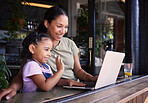 Mother, daughter and laptop for video call in cafe, greeting and conversation for quality time, relax or chatting. Love, mama or girl in coffee shop, online for connection or communication with smile