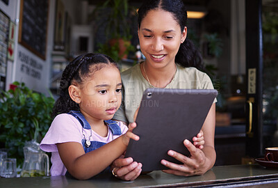 Buy stock photo Digital tablet, coffee shop and mother with her child reading the online menu before ordering. Technology, internet and mom on a date with her girl kid with a touchscreen mobile device in a cafe.