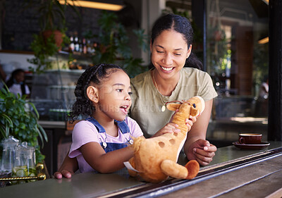 Buy stock photo Black family, coffee shop or stuffed animal with a mother and daughter sitting in the window of a restaurant together. Kids, love or toys with a woman and female child bonding in a cafe on a weekend