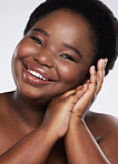 Black woman, hands and smile for gentle skincare beauty, cosmetics or makeup against a gray studio background. Portrait of happy African American female smiling and touching face in self love or care