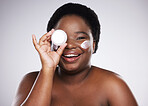 Portrait, black woman and cream for skincare, dermatology and cosmetics with girl on grey studio background. Face lotion, African American female and lady with beauty, creme and wellness on backdrop