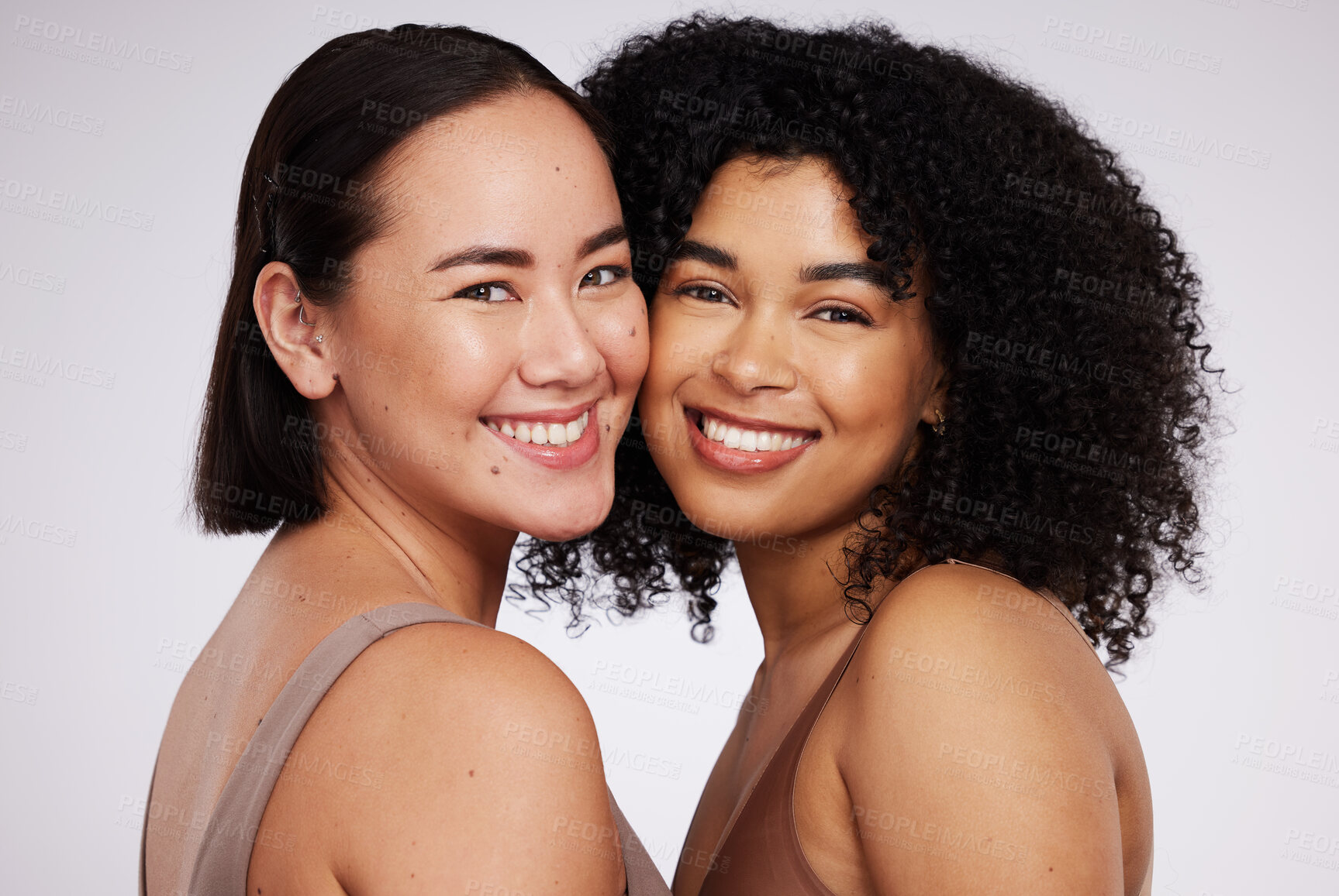 Buy stock photo Diversity, beauty and portrait of women for skincare, wellness and body positivity in studio. Dermatology, self love and face of Asian and black girl for luxury cosmetics, makeup and natural glow