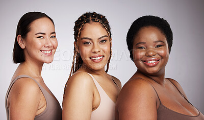 Buy stock photo Portrait, skin and diversity with woman friends in studio on a gray background together for skincare beauty. Face, makeup and natural with a female model group posing to promote support or inclusion