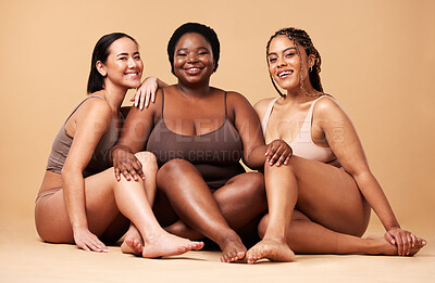 Buy stock photo Diversity, women friends and body portrait with skin glow group together for inclusion, beauty and power. Underwear model people on beige background with a smile, pride and motivation for self love