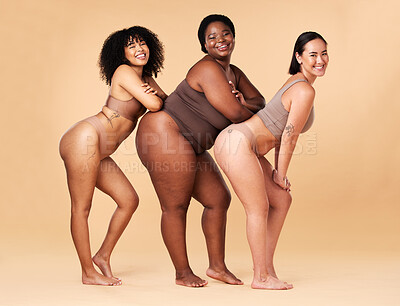 Buy stock photo Diversity women, body size and portrait of group together for inclusion, beauty and power. Underwear model friends happy on beige background with cellulite legs, skin pride and self love motivation