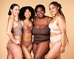 Body, diversity and portrait of different women group hug for inclusion, beauty and skincare. Aesthetic model people or friends on beige background with glow, underwear and motivation for self love