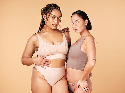 Buy stock photo Confidence, empowerment and portrait of women in underwear isolated on a studio background. Sexy, support and models in lingerie for body positivity, comparison and acceptance on a beige backdrop