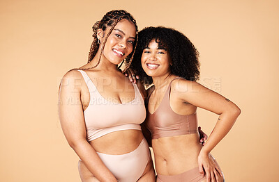 Buy stock photo Skincare, beauty and black women friends in underwear in studio isolated on a brown background. Empowerment portrait, lingerie and body positive happy girls with makeup, cosmetics and healthy skin.