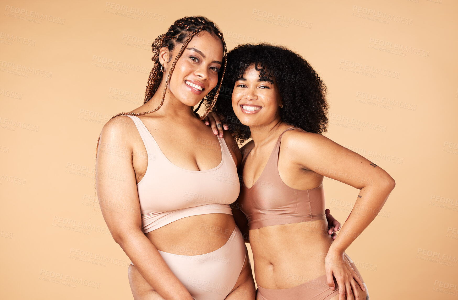 Buy stock photo Skincare, beauty and black women friends in underwear in studio isolated on a brown background. Empowerment portrait, lingerie and body positive happy girls with makeup, cosmetics and healthy skin.