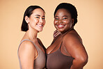 Friends, diversity and beauty of women in lingerie in studio isolated on a brown background. Empowerment portrait, underwear and body positive happy girls with makeup, cosmetics and healthy skincare.