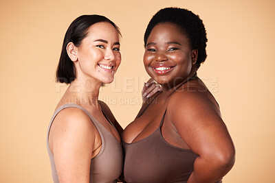 Buy stock photo Friends, diversity and beauty of plus size women in studio isolated on a brown background. Empowerment portrait, underwear and body positive happy girls with makeup, cosmetics and healthy skincare.