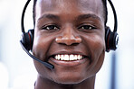 Crm, portrait or happy black man consulting in call center helping, consulting or talking at customer support. Smile, face or African sales consultant in a telemarketing or communications company