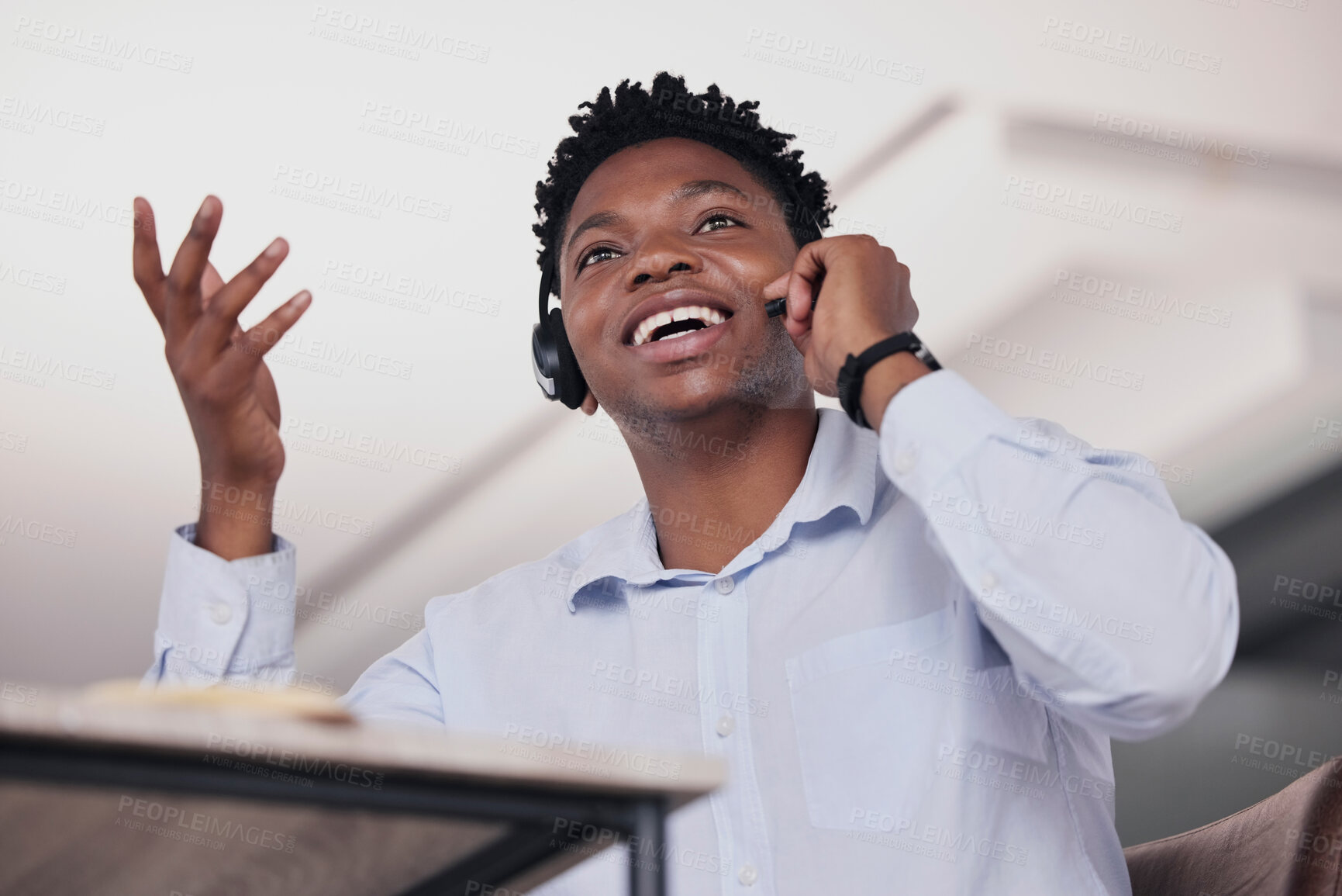 Buy stock photo Call center, black man and communication in low angle for customer service, telemarketing and office consultant. Sales agent talking on headset for tech support, questions and telecom lead generation