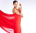 Fabric, red and portrait of woman for beauty, fashion and style isolated against a studio white background. Female, African and young model with cloth as a dress in luxury and glow on skin