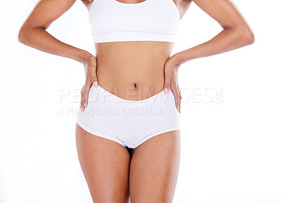 Health, fitness and stomach, woman in underwear on diet and tummy tuck,  hands on skinny waist isolated on white background. Fitness, healthcare and  slim figure girl, liposuction or workout in studio.