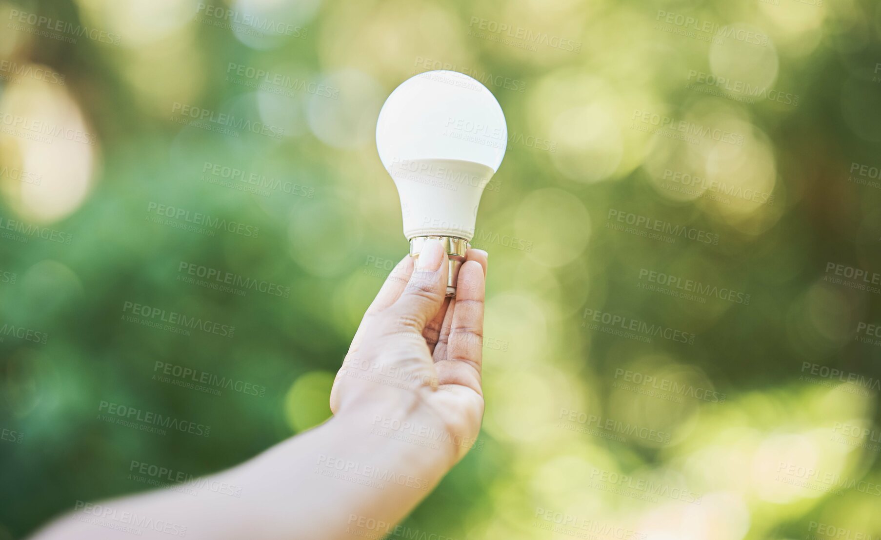 Buy stock photo Nature, renewable energy and eco friendly lightbulb in garden and innovation, saving the planet and environment. Recycle, green lamp and sustainability in electricity idea with bokeh and light power.