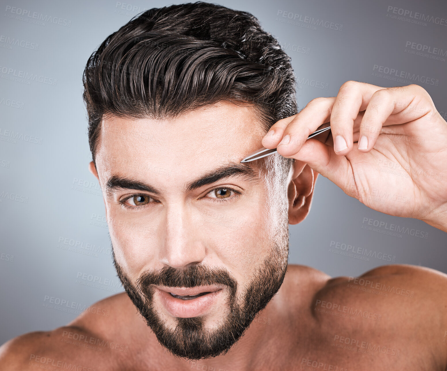 Buy stock photo Face, portrait and man with tweezers in studio isolated on a gray background for wellness. Health, hair removal and male model with facial product to pluck eyebrows for grooming, hygiene and beauty.