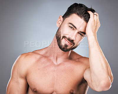 Buy stock photo Beauty, smile and portrait of man with hand in hair, sexy beard maintenance and healthy skincare. Fitness, health and spa facial care, male model with muscle in studio isolated on grey background.