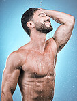 Body, man and water for cleaning, morning routine and grooming against a blue studio background. Skincare, male and gentleman with cosmetics, wet and drops for hygiene, beauty or wellness on backdrop