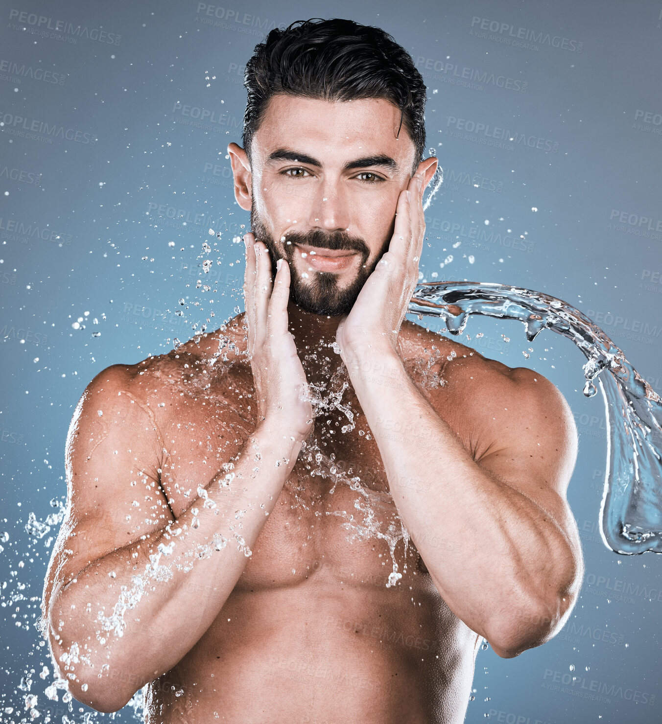 Buy stock photo Water splash, face and shower with man in portrait for beauty and skincare isolated on studio background. Smile, facial and cleaning body with muscle, sustainable dermatology with natural cosmetics