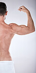 Fitness, health or strong man flexing muscle after exercise, training or gym workout for body goals. Sports motivation, back view or healthy bodybuilder athlete with biceps muscles isolated in studio