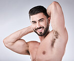 Arm muscle, man and face with body in portrait, health and fitness with strong person isolated on studio background. Skin, bodybuilder and biceps, wellness and cosmetic care with growth with exercise