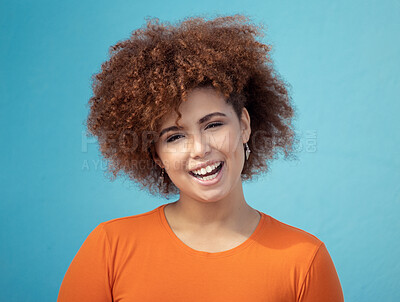 Buy stock photo Black woman, portrait smile and afro for profile, vision hair style against blue studio background. Happy African American female smiling with teeth in joyful happiness or positive attitude on mockup