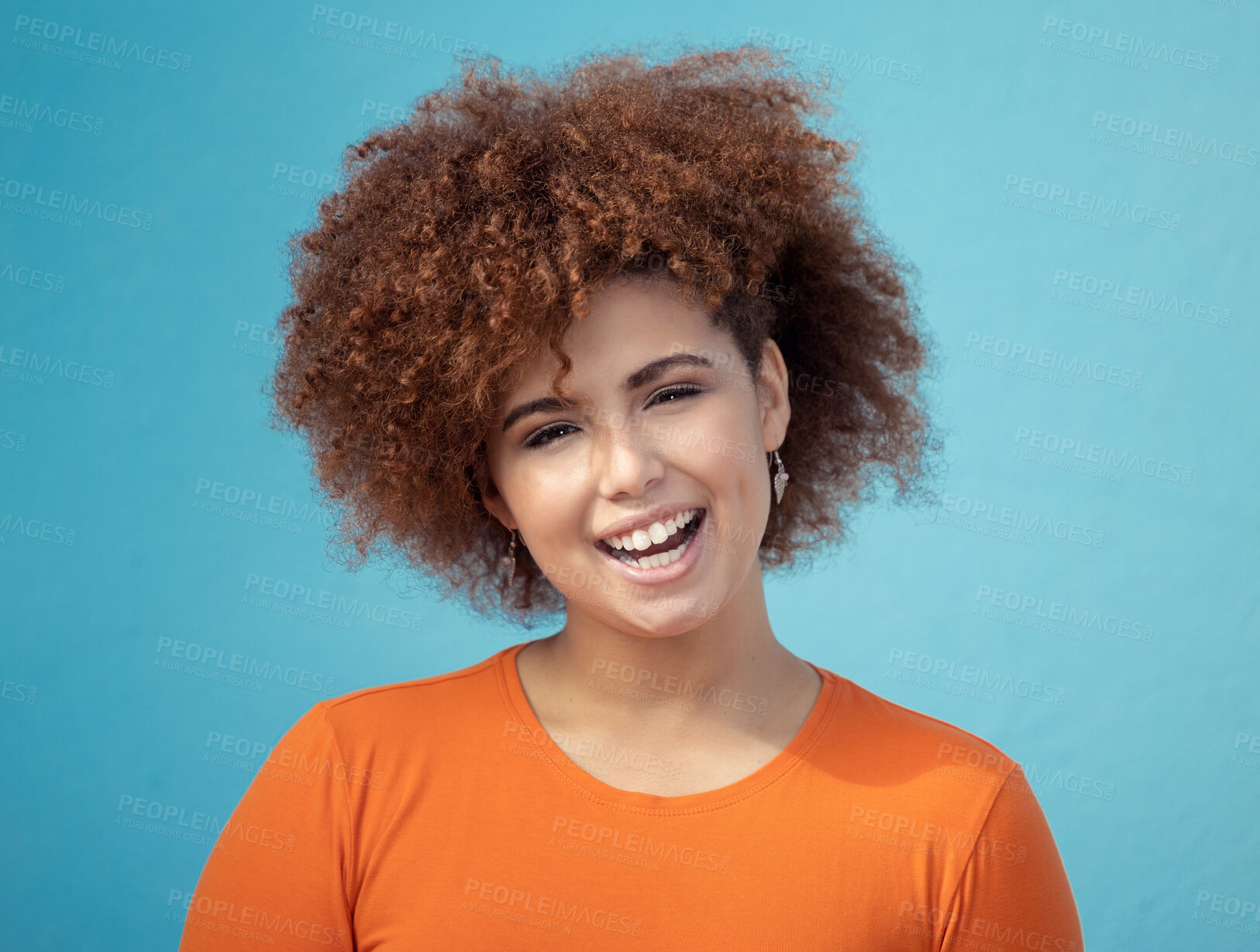 Buy stock photo Black woman, portrait smile and afro for profile, vision hair style against blue studio background. Happy African American female smiling with teeth in joyful happiness or positive attitude on mockup