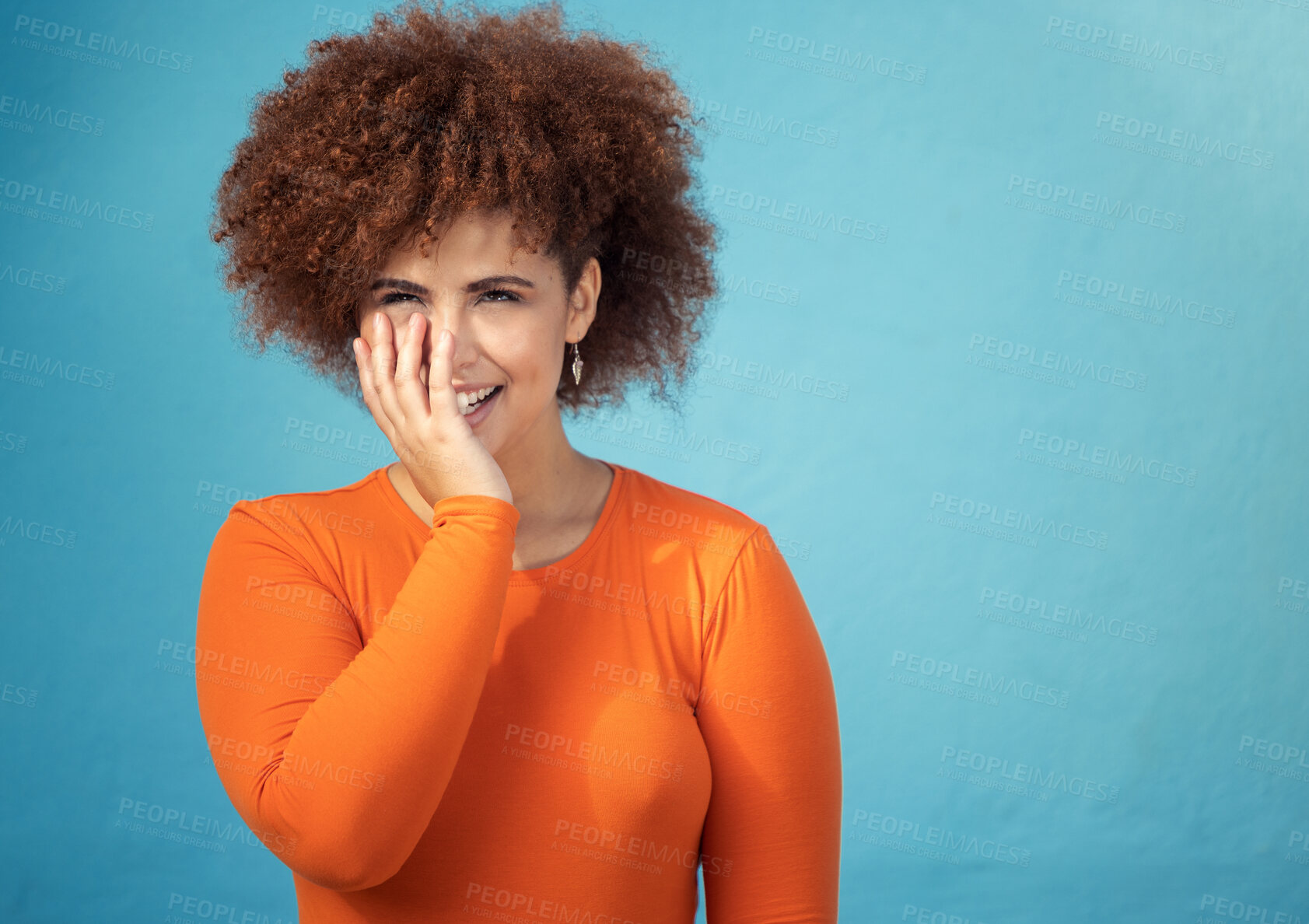 Buy stock photo Happy, shy and young woman in studio with a positive, optimistic and innocent mindset. Happiness, giggle and excited female model from Mexico with smile posing while isolated by turquoise background.