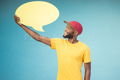 Buy stock photo Speech bubble, advertising and black man on blue background for announcement, news and information. Marketing, opinion mockup and male smile with copy space on poster, billboard and sign for voice