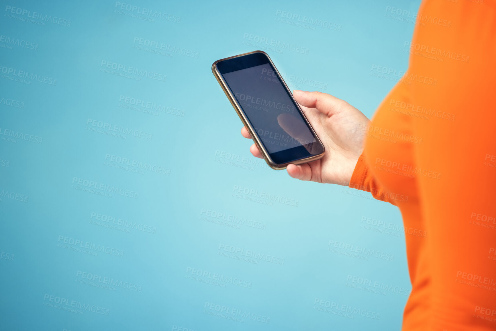 Buy stock photo Hand, mockup screen and woman phone for advertising sale, promotion or brand website on internet. Person with smartphone on blue background studio for about us, communication or network connection