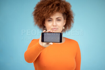 Buy stock photo Mockup screen, phone and woman advertising sale, promotion or brand on website or internet. Person with smartphone in hand on blue background studio for about us, online contact or network connection