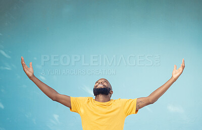 Buy stock photo Studio space, advertising and open arms of black man for announcement, news and information on blue background. Marketing, mockup and excited male for promotion, product placement and discount deal