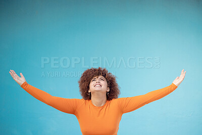 Buy stock photo Advertising, studio space and open arms of black woman for announcement, news and sale. Marketing, discount mockup and girl present, show and display copyspace for promotion on blue background